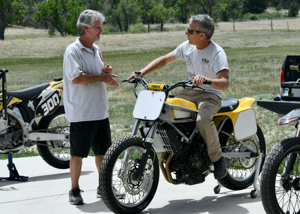 Ignore the color of the hair, or lack of color…both Tom Williams (left) and Nick Ienatsch (right) were entranced with the newly-built C&J Yamaha MT-07. Photo by Kathy Weber.