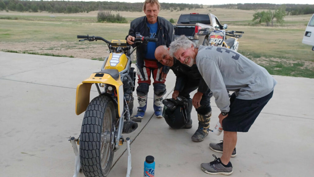 (From left) Kelly Larkin, Bruce Sass, and Tom Williams examining Tom’s new C&J Yamaha MT-07. Bruce built the bike, and Tom has raced it twice since this testing day, joining Larkin and Sass in competition. Photo by Nick Ienatsch.