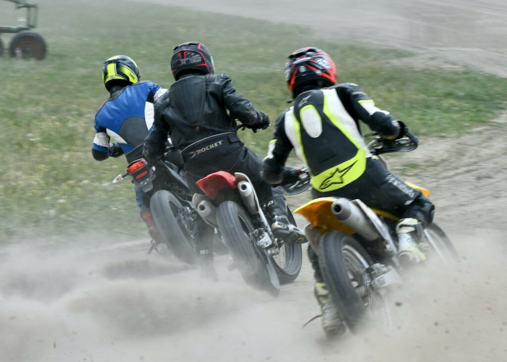 Old guys Ryan Stewart (center) and Nick Ienatsch (right) chase young kid Coy Weber (left). Weber, age 17, is on a Zero while Ryan and I are on well-prepared four-stroke 450-ish single flat trackers. Photo by Kathy Weber.