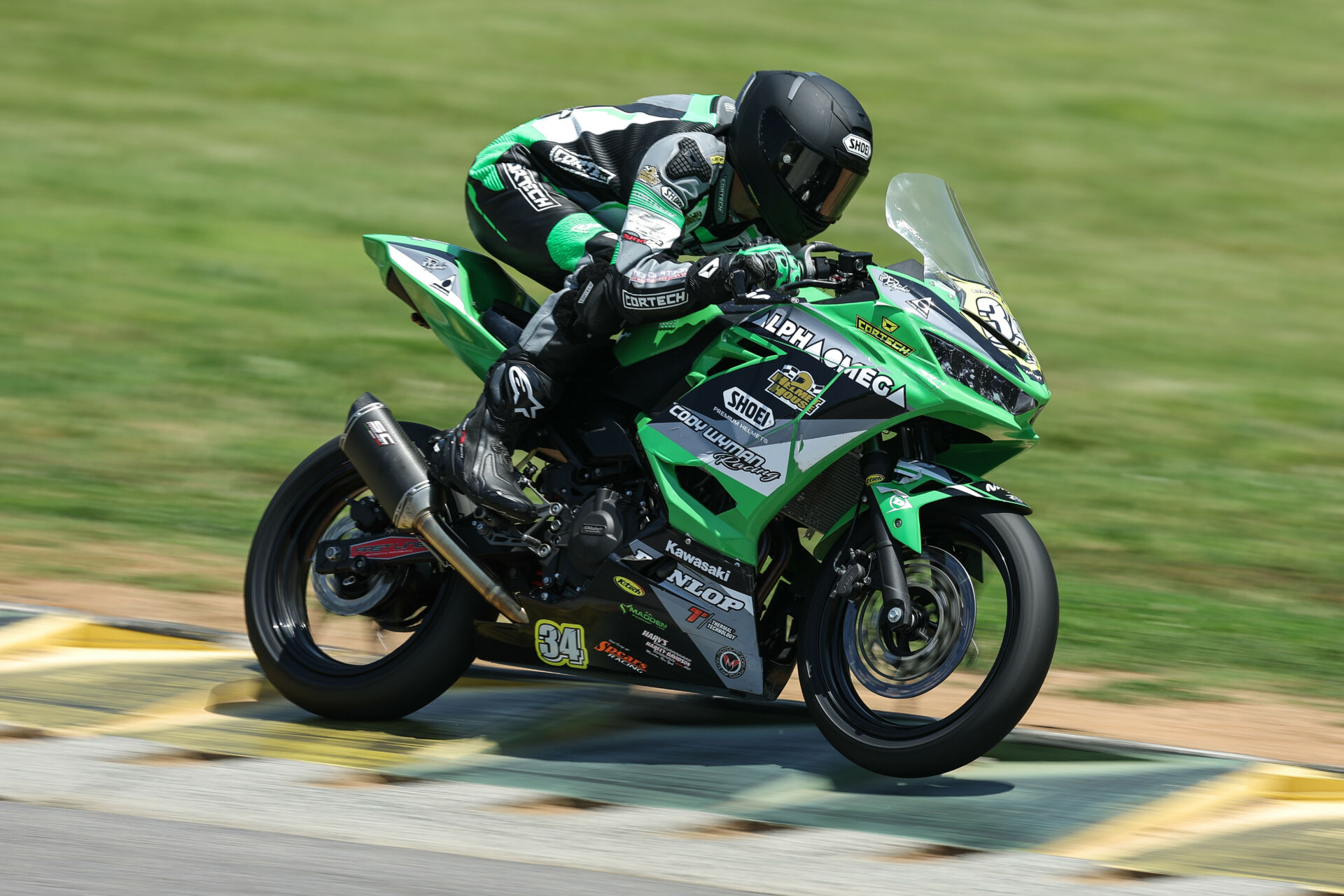 Cody Wyman (34) at speed on his Alpha Omega Kawasaki Ninja 400 MotoAmerica Junior Cup racebike. Photo by Brian J. Nelson.