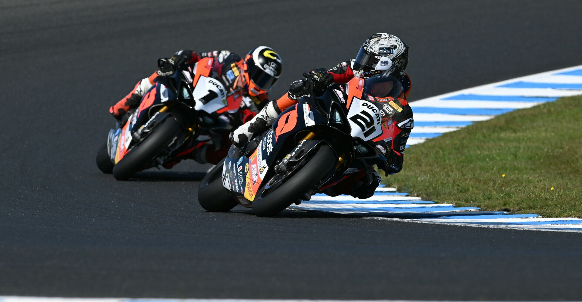 Josh Waters (21) looks back at Wayne Maxwell (1) during a race on Sunday at Phillip Island. Photo courtesy ASBK.