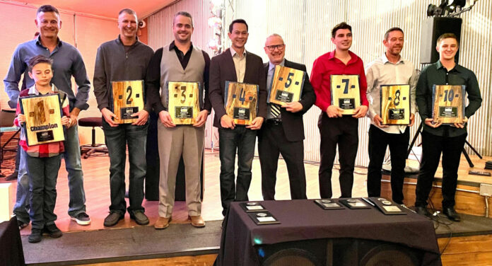 MRA’s top-10 overall finishers in attendance (from left): Mike Applegate and his son Jake, James Wilkerson, Jared Dear, Ken Yee, Kevin Madden, Cameron Lee, Daniel Spurlock, and Justen Behmer. The top-10 plaques were handcrafted and donated by Gus Paw Creations/Chris Nami. Photo by Bob Hasenhundl, courtesy MRA.