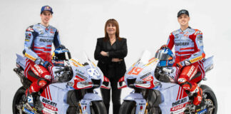 Team Gresini Racing MotoGP owner Nadia Padovani (center) with riders Alex Marquez (left) and Fabio Di Giannantonio (right) and their Ducati Desmosedici GP22 racebikes. Photo courtesy Gresini Racing.
