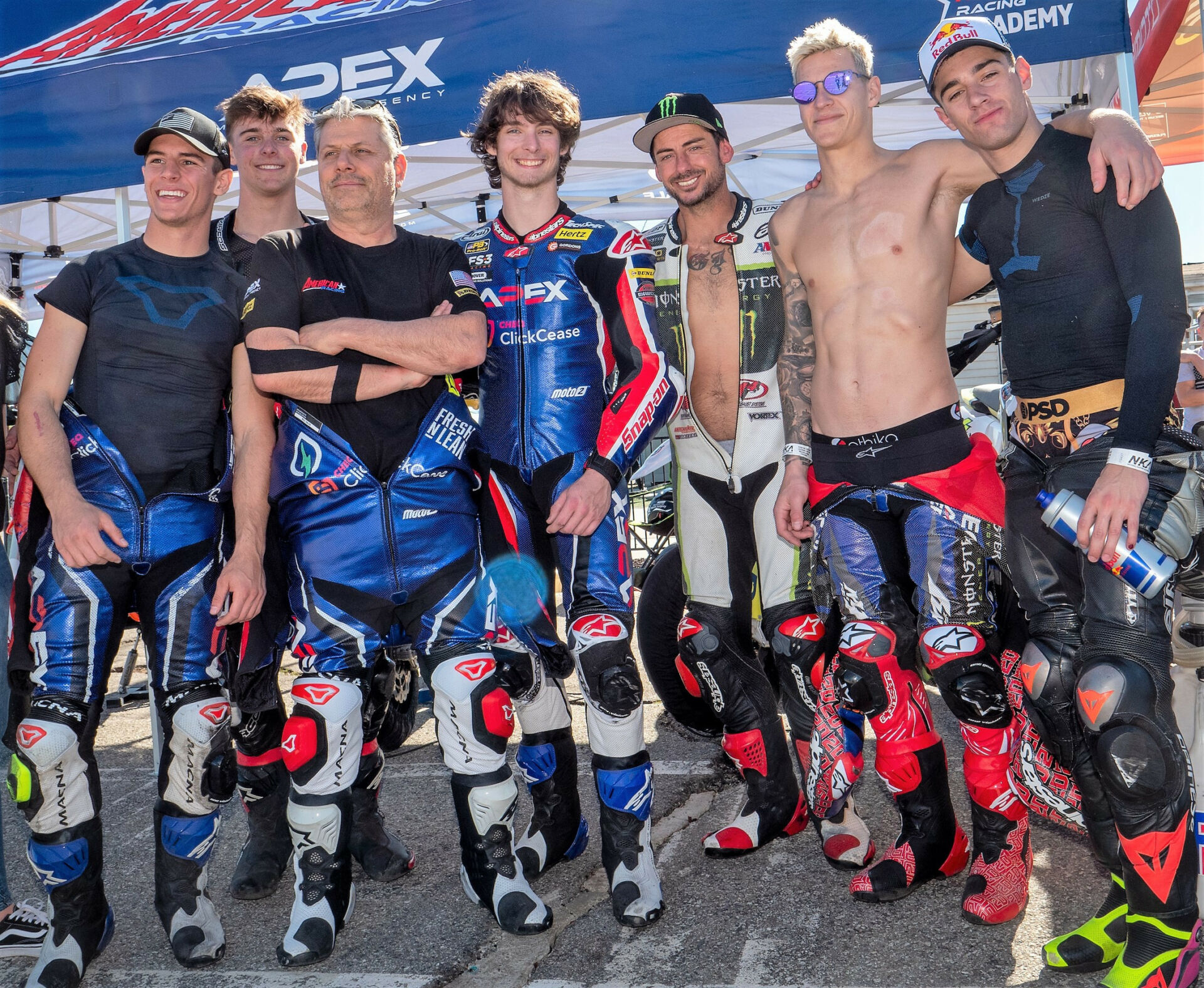 American Racing Team's (from left) Sean Dylan Kelly, Max Toth, Eitan Butbul, Rory Skinner, and John Hopkins with 2021 MotoGP World Champion Fabio Quartararo and Moto2 World Championship rider Tony Arbolino. Photo courtesy American Racing Team.