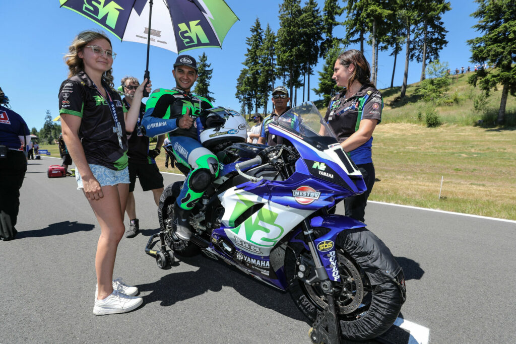 Kevin Olmedo on the grid with members of his N2 Racing Yamaha team, including Crew Chief Shiloh Salopek (right), at Ridge Motorsports Park in 2022. Photo by Brian J. Nelson.