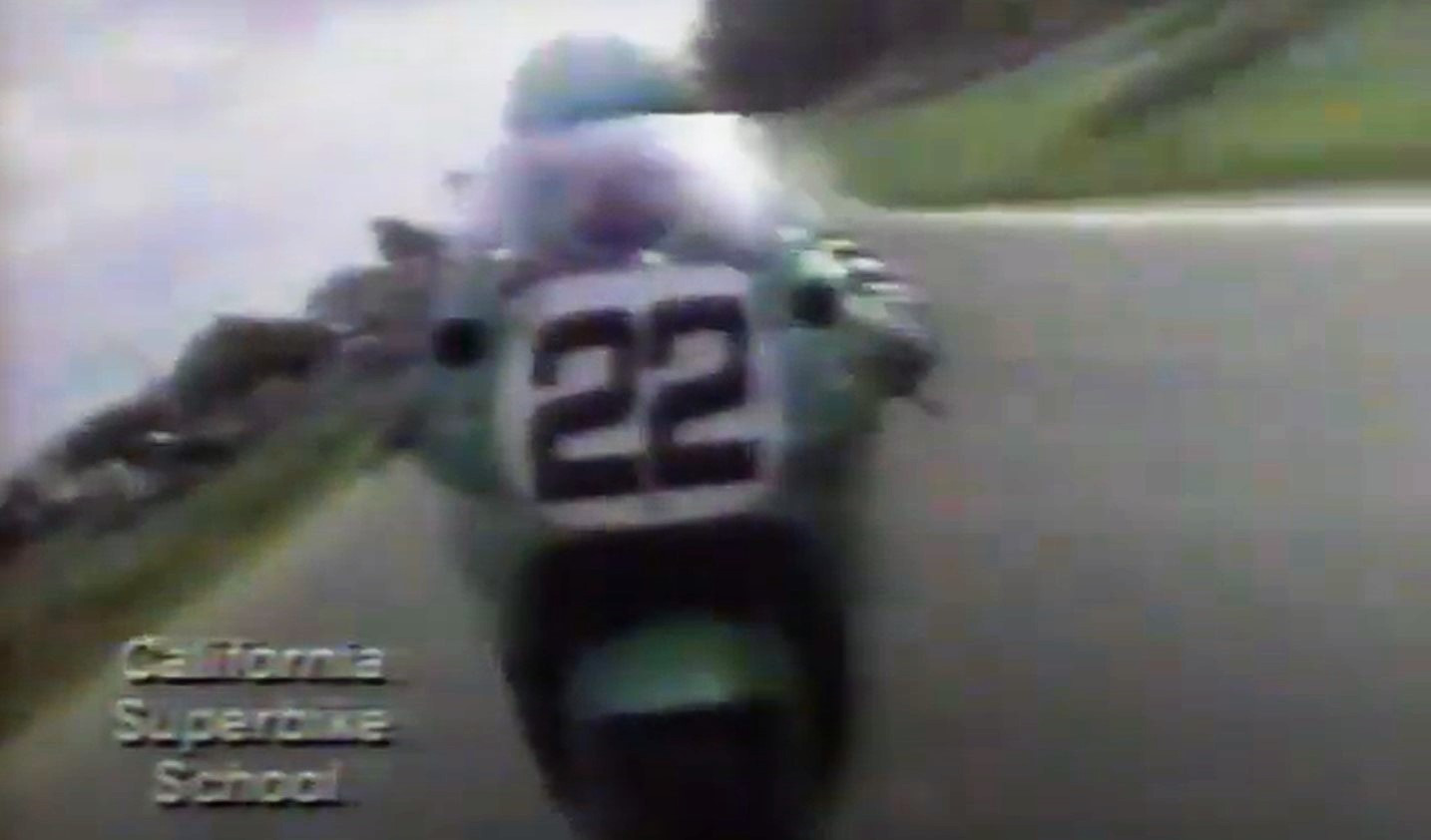 Scott Russell (22), riding a Muzzy Kawasaki ZX-7 Superbike, fills the on-board camera shot from the back of Chuck Graves' Suzuki GSX-R1100 Superbike during the coverage of a Formula USA race at Road Atlanta in 1990.