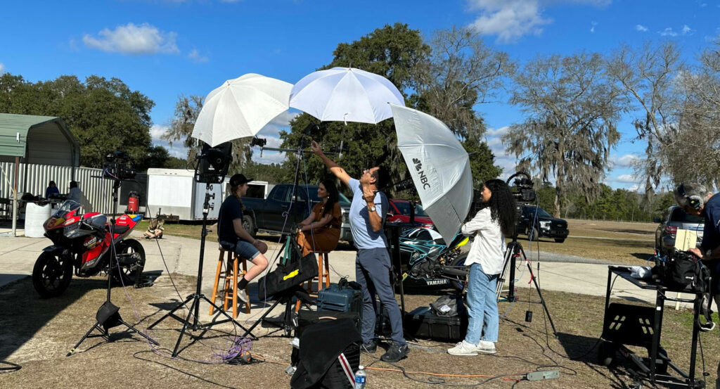 MotoAmerica racer Kayla Yaakov is interviewed by TODAY Show contributor Donna Farizan at Jennings GP, in Florida. Photo by David Yaakov.