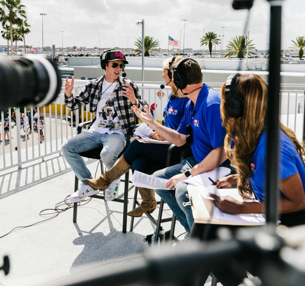 Brandon Paasch doing a live TV interview with FOX35 Orlando prior to the Daytona 500. Photo courtesy Brandon Paasch.