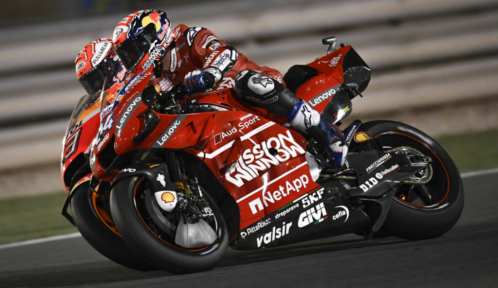 Andrea Dovizioso (04) had many duels with Marc Marquez (93) in MotoGP. This one is from Qatar in 2019. Photo courtesy Dorna.