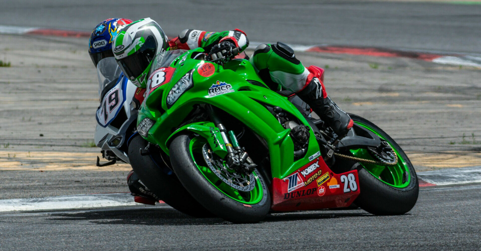 MRA racers David Lambert (28) and Mike Applegate (79) battle for position at Pikes Peak International Raceway. Photo by Kelly Vernell, courtesy MRA.