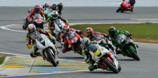 MotoAmerica has banned the use of lithium polymer batteries on racebikes. This photo shows action from the 2022 Daytona 200 with Cameron Petersen (45) leading Brandon Paasch (96), Richie Escalante (behind Petersen), Max Angles (64), Josh Herrin (2), Danny Eslick (69), Geoff May (99), and Josh Hayes (4). Photo by Brian J. Nelson, courtesy MotoAmerica.