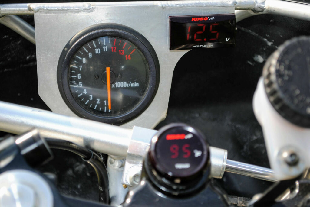 Steve Long dug around the Speedwerks shop and found “the last Graves Motorsports FZR fairing stay in existence” and brought it into the modern world with a Koso voltmeter matched to a Koso coolant-temp sensor mounted in the stock ignition-key location. A steering damper was added in an out-of-harm’s-way location. Photo courtesy Speedwerks.