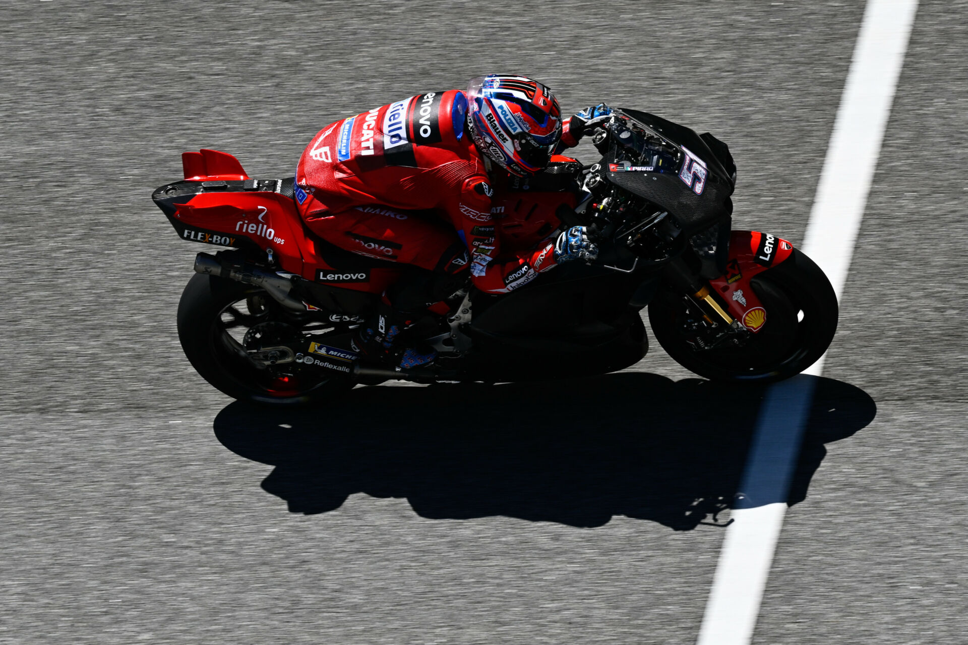 Ducati test rider Michele Pirro (51) tucked in on a Desmosedici GP23 at Sepang. Photo courtesy Dorna.