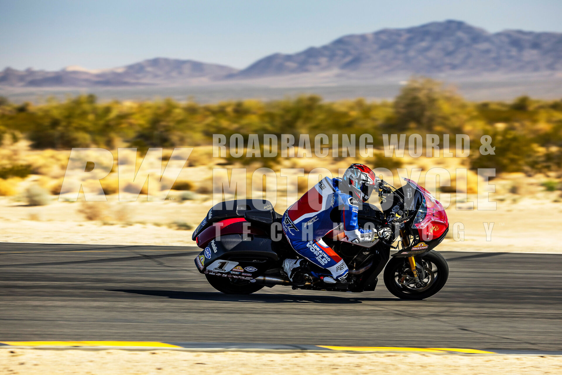 Heavy Intensity: Chris Ulrich, test-riding the Indian Challenger Bagger on the racetrack at Chuckwalla Valley Raceway: 