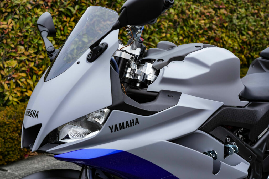 Yamaha's Advanced Motorcycle Stabilization Assist System (AMSAS) YZF-R25 test mule has steering actuators for minute steering inputs to help maintain balance at low speeds. Photo courtesy Yamaha.