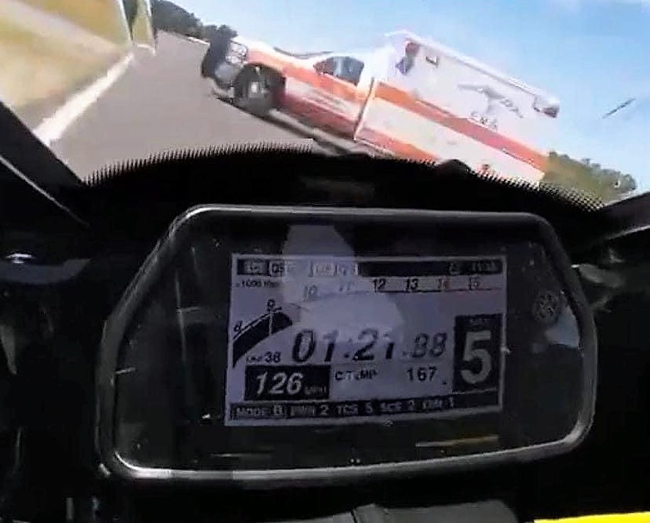 An ambulance crossing the front straightaway during a race March 19 at Roebling Road Raceway, as seen from the on-board camera on Daniel Alexander's motorcycle.