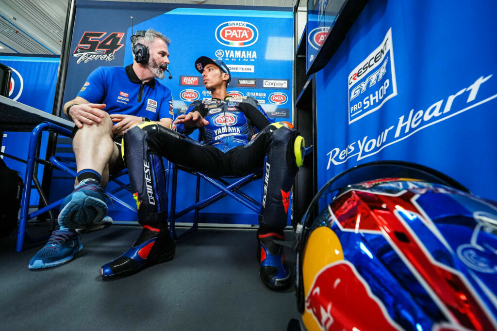 Toprak Razgatlioglu (right) in his garage. Photo courtesy Dorna.