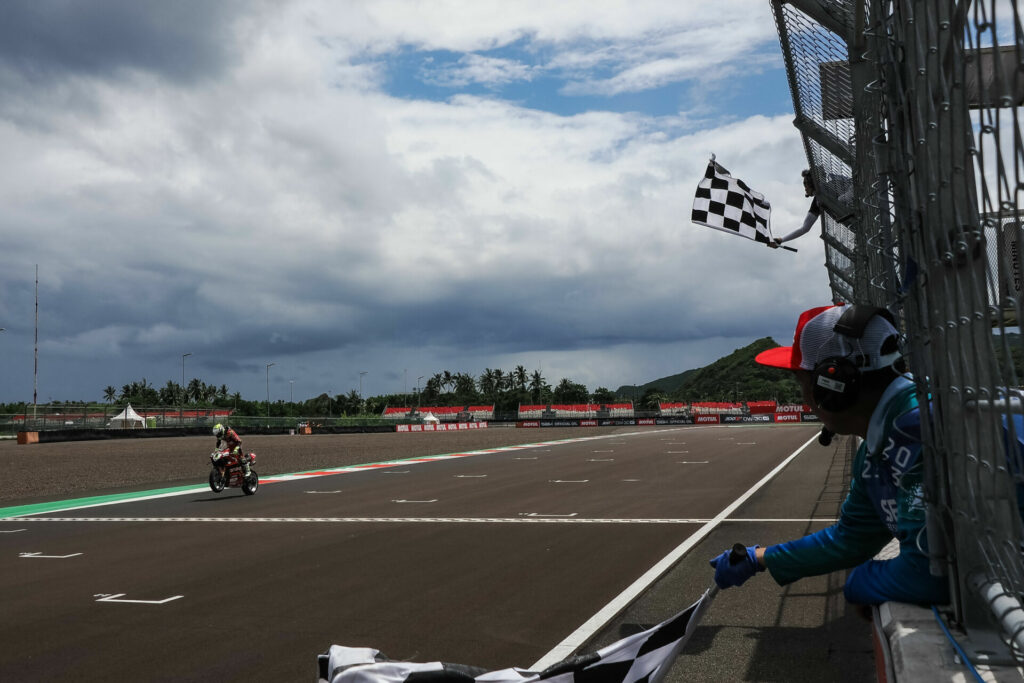 Alvaro Bautista (1) wheelies across the finish to win Race One in Indonesia. Photo courtesy Dorna.