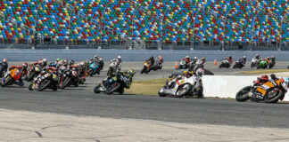 The original start of the 81st Daytona 200 with Josh Herrin (1) leading Danny Eslick (69), PJ Jacobsen (66), Richie Escalante (54), Tyler Scott (70), Geoff May (99), and the rest through Turn One. Photo by Brian J. Nelson.