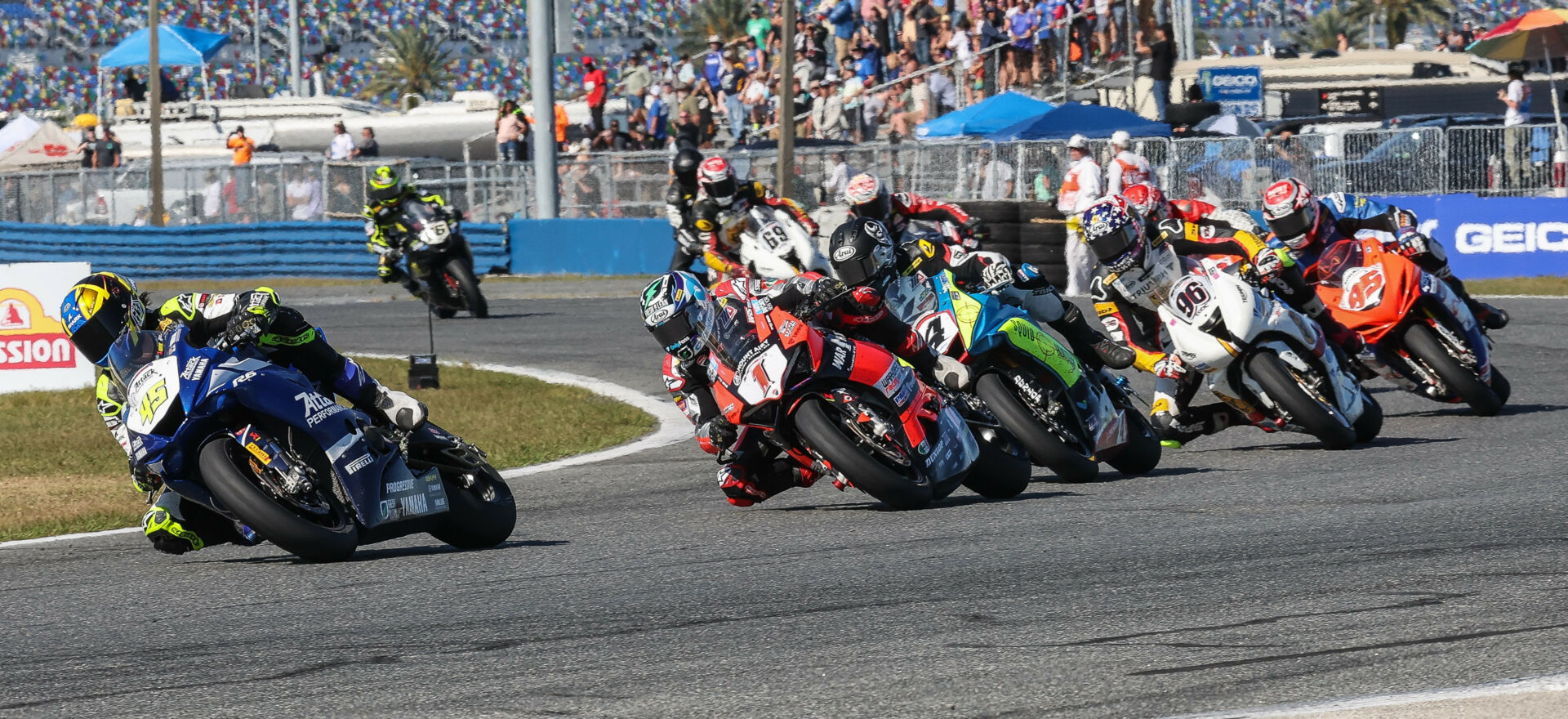 Late in the restarted 81st Daytona 200, Cameron Petersen (45) leads Josh Herrin (1), Josh Hayes (4), Brandon Paasch (96), Hayden Gillim (95), Geoff May (behind Paasch), Teagg Hobbs (behind Hayes), Danny Eslick (69), Blake Davis (behind Eslick), PJ Jacobsen (66), and the rest. Photo by Brian J. Nelson.