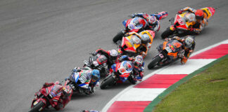 Action from the MotoGP race in Portugal in 2022 with Fabio Quartararo (20) leading a group of riders. Photo courtesy Dorna.