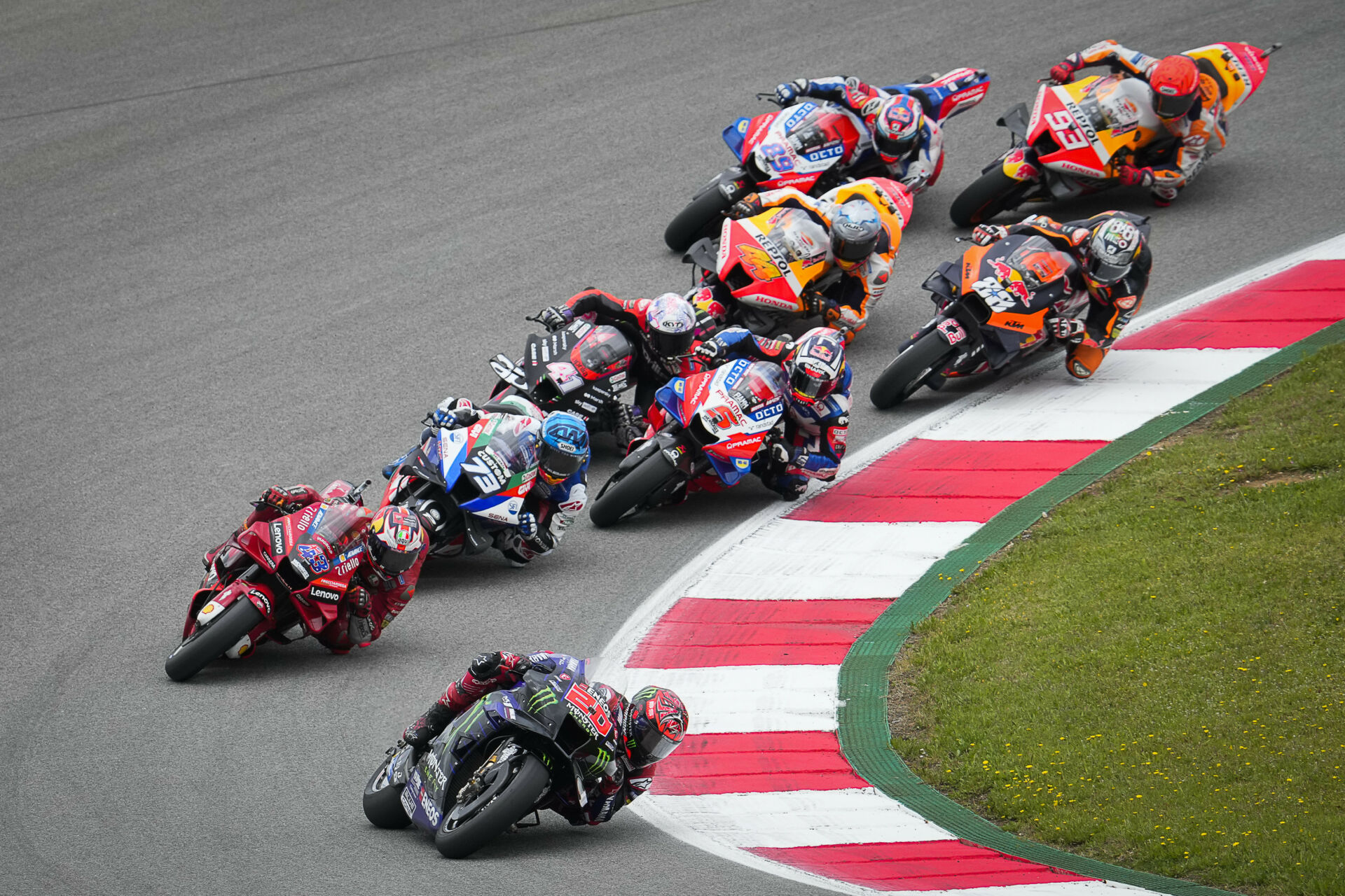 Action from the MotoGP race in Portugal in 2022 with Fabio Quartararo (20) leading a group of riders. Photo courtesy Dorna.