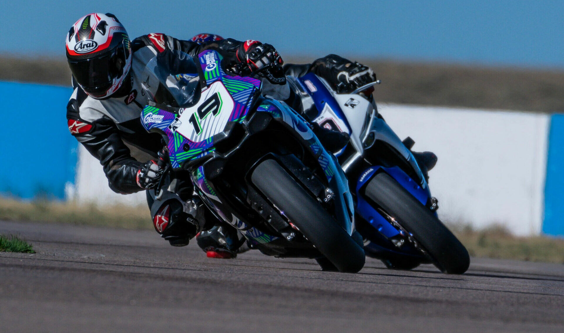 Dan Spurlock (19) leading Mike Applegate (79) at High Plains Raceway’s West Course during Round 6 of the 2022 MRA season. Photo by Kelly Vernell, courtesy MRA.