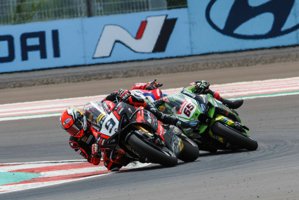 Danilo Petrucci (9) leads Jonathan Rea (65) and a Team HRC Honda rider. Photo courtesy Dorna.