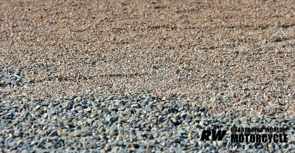 After years of rider objections, the gravel in the most common run-off areas at the Autodromo was replaced prior to the MotoGP riders going on track this weekend. Note how much smaller the rocks at the top of the screen are, compared to the rocks at the bottom. Photo by Michael Gougis.