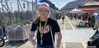 Kayla Yaakov on crutches on pit lane at Daytona International Speedway. Photo by John Ulrich.
