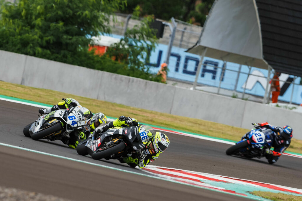 Niki Tuuli (66) leads Federico Caracasulo (64). Tuuli got his first podium finish with Triumph. Photo courtesy Dorna.