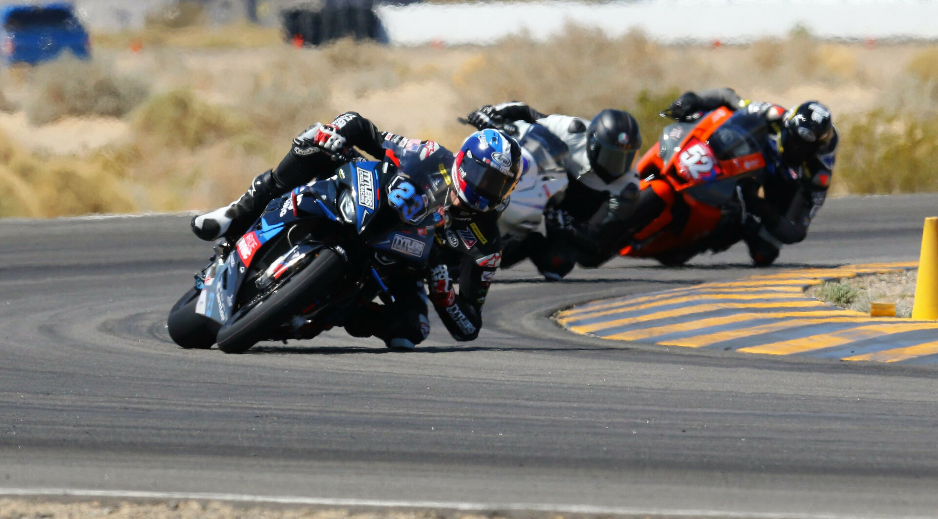 Corey Alexander (23) leads Anthony Norton (behind Alexander), and Ben Smith (52) at Chuckwalla Valley Raceway. Photo by CaliPhotography.com, courtesy CVMA.