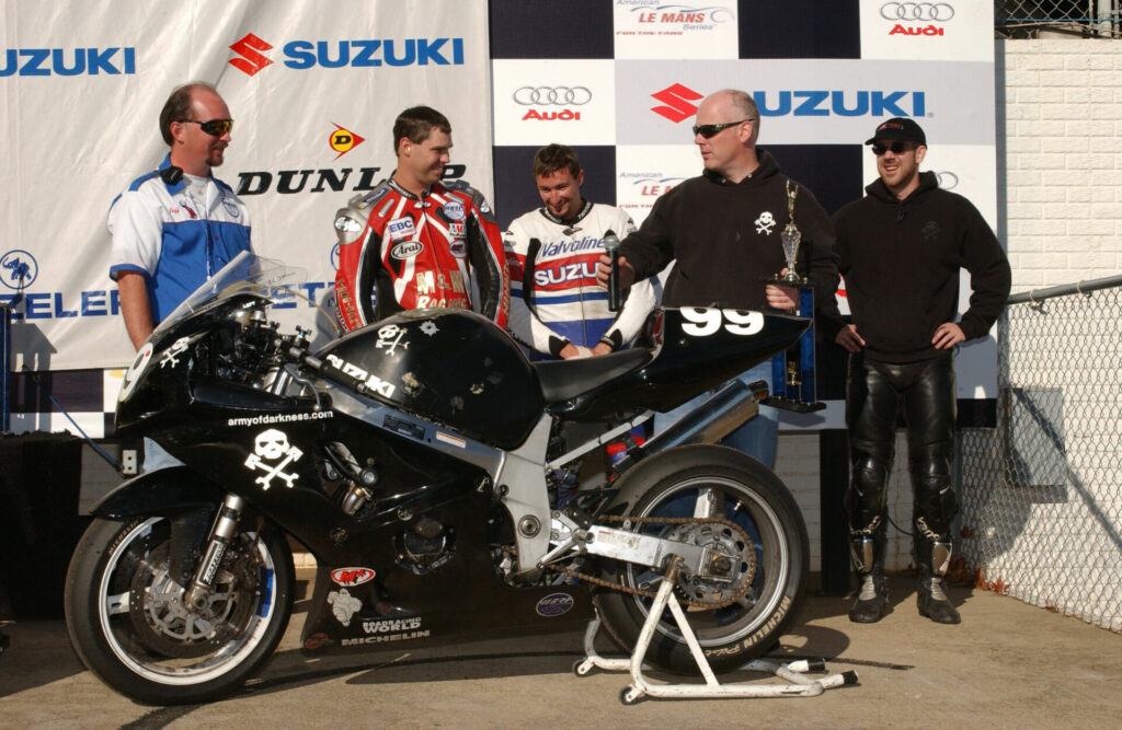 AOD riders Brian Stokes (second from left), Josh Hayes (center), Jim Williams (second from right), and Sam Fleming (far right) celebrate a victory at Road Atlanta in 2002. Photo courtesy Army of Darkness.
