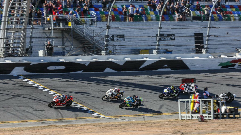 Josh Herrin (1) crosses the finish line ahead of Josh Hayes (4), Brandon Paasch (96) and Cameron Petersen (45) at the end of the Daytona 200. Paasch was penalized 15 seconds for a pit-lane infraction and was dropped to 12th in the final results. Photo by Brian J. Nelson