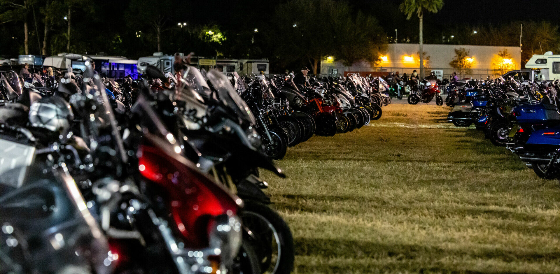 A view of the motorcycle parking area Thursday night at the American Flat Track (AFT) Daytona Short Track I at Daytona International Speedway.