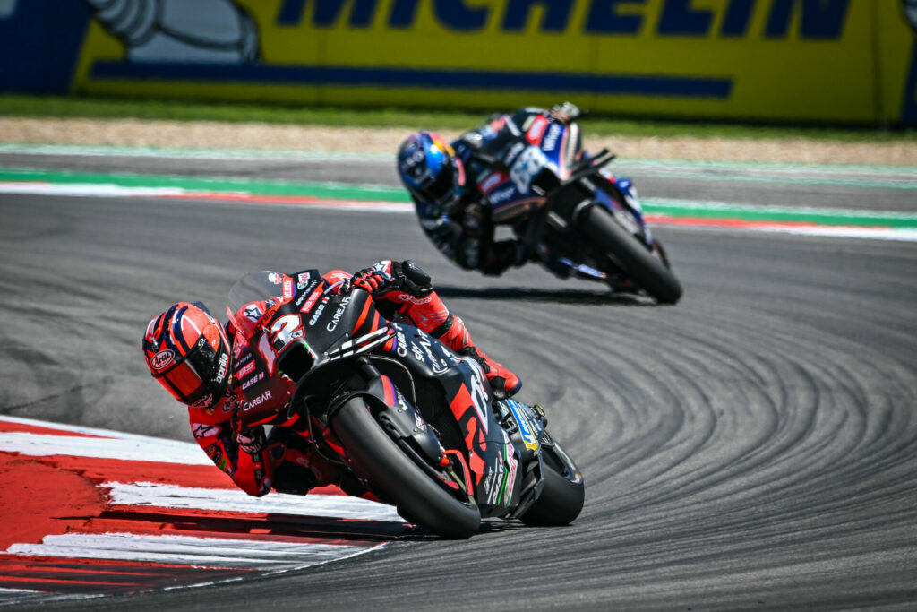 Maverick Vinales (12) leads Miguel Oliveira (88). Photo courtesy Aprilia.