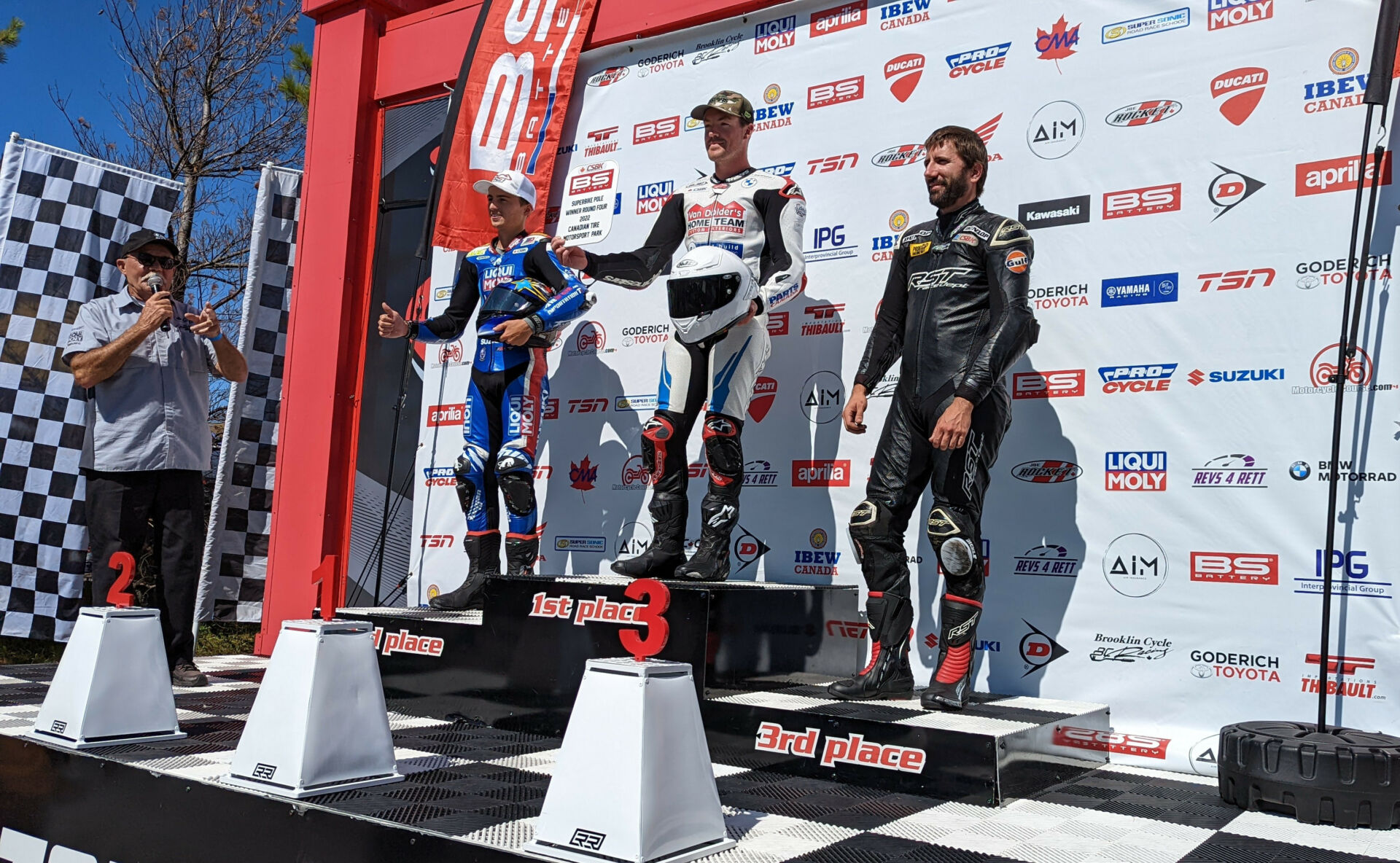 At the final CSBK round of 2022 at CTMP, BS Battery Pole winner and overall Pole Champion Ben Young (center) celebrates on Friday’s Qualifying Podium with Suzuki’s Alex Dumas (left) and Kawasaki’s Sebastien Tremblay (right). Photo by Colin Fraser, courtesy CSBK.