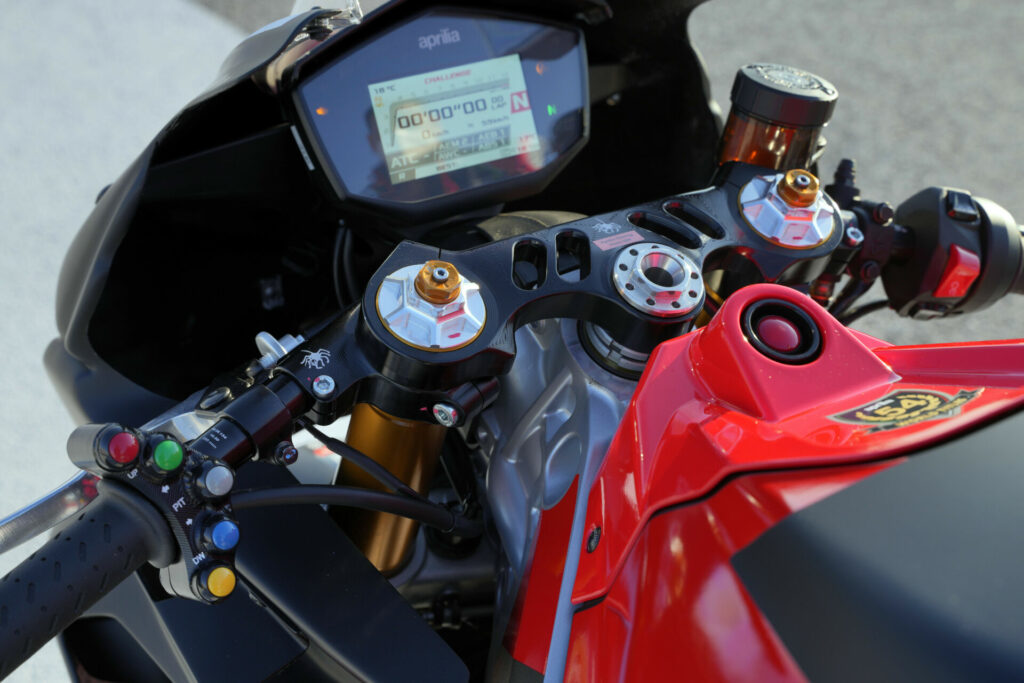 The Aprilia RS 660 Trofeo features a racing top triple clamp that allows adjustment of the clip-on handlebars, which are fitted with buttons to control other features like a pit lane speed limiter and rider aids. Photo courtesy Aprilia.