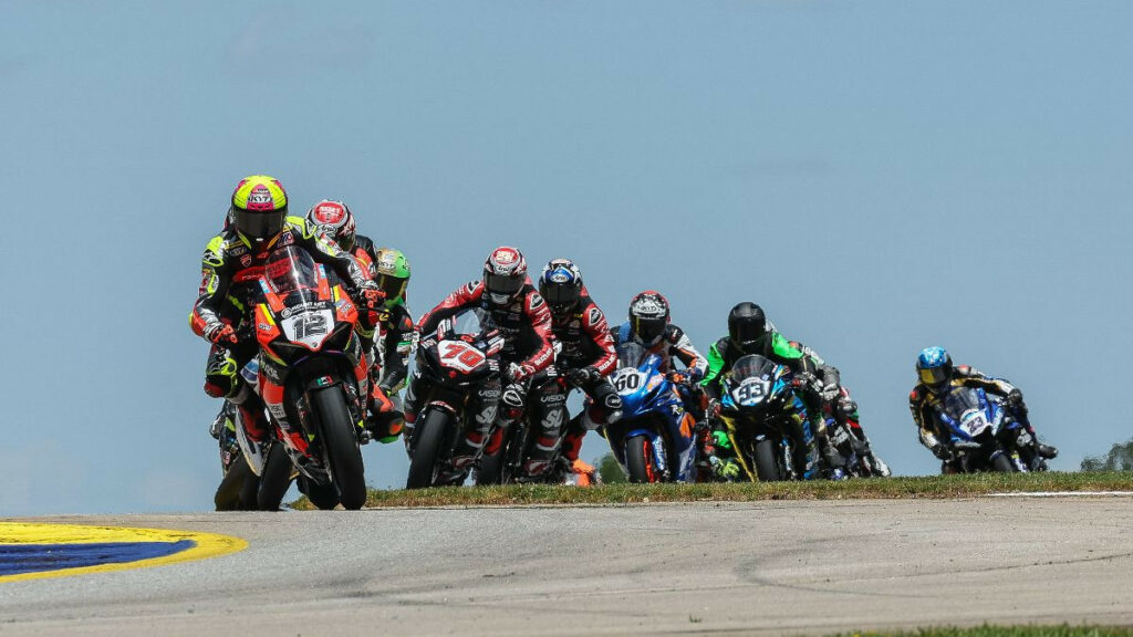 Xavi Fores (12) won his first MotoAmerica Supersport race on Saturday with a close victory over Tyler Scott (70) and Josh Hayes. Photo by Brian J. Nelson.