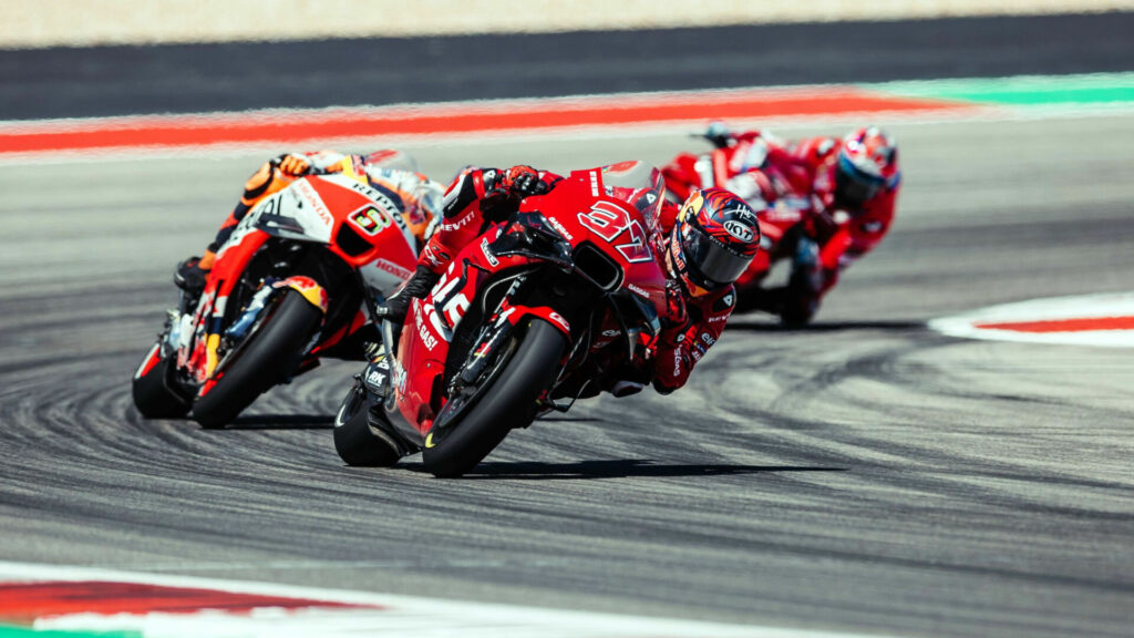 Augusto Fernandez (37) leads Stefan Bradl (6) and Michele Pirro (51). Photo courtesy GASGAS Factory Racing Tech3.