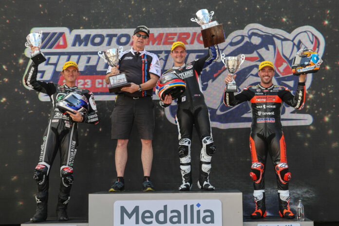 Medallia is continuing its title sponsorship of the 2023 MotoAmerica Medallia Superbike Championship. Here, Road Atlanta Race One winner shares the podium with his Crew Chief Dave Weaver, runner-up Jake Gagne (left) and third-place finisher Josh Herrin (right). Photo by Brian J. Nelson.