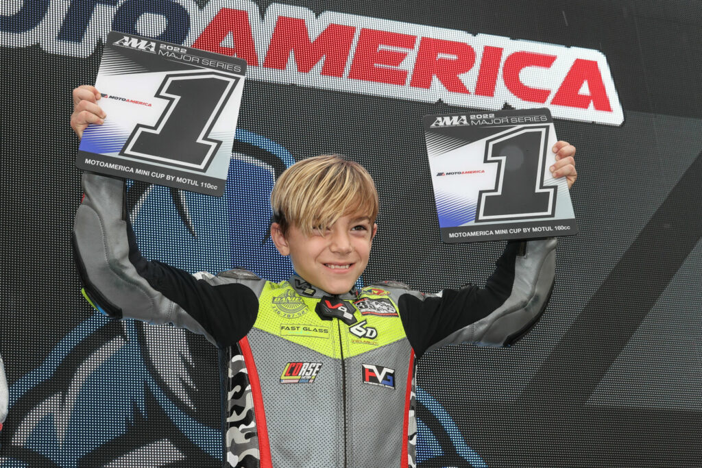 Nathan Gouker with his two MotoAmerica Mini Cup #1 plates at the end of the 2022 season. Photo by Brian J. Nelson.