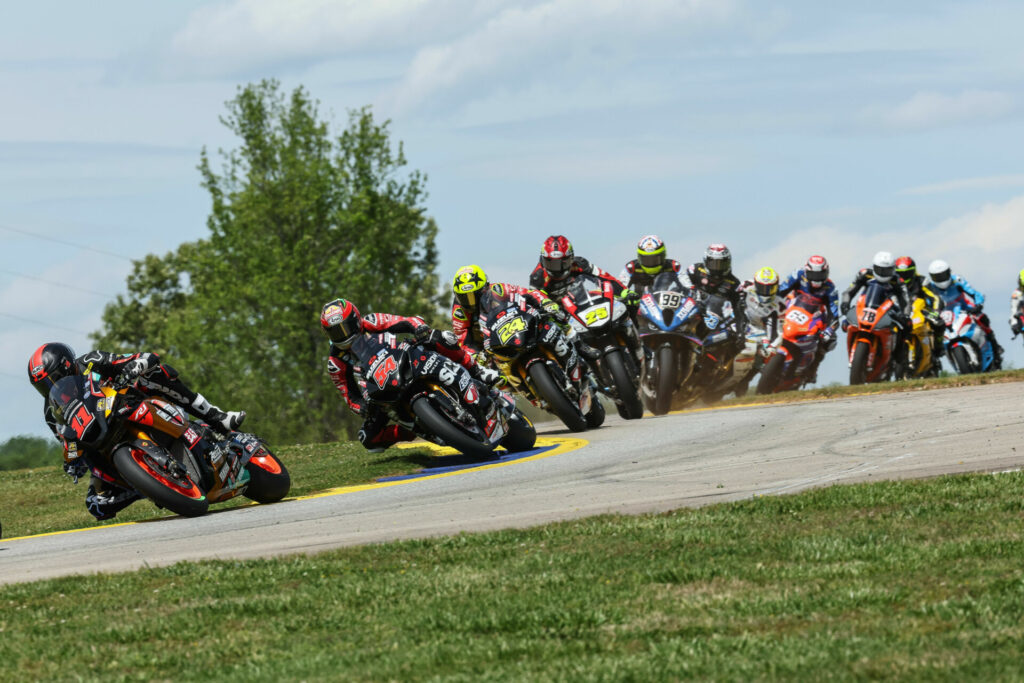 Mathew Scholtz (11) leads a group of riders during MotoAmerica Superbike Race Two at Road Atlanta. Photo by Brian J. Nelson, courtesy Westby Racing.