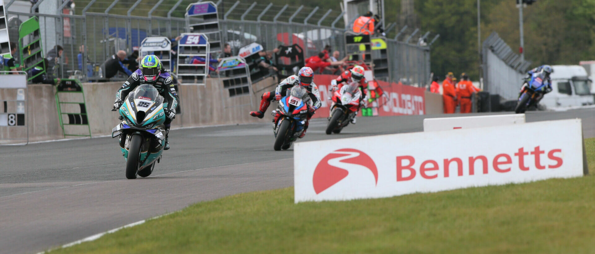 Josh Brookes (25) leads Leon Haslam (91) and the rest during Race One at Oulton Park. Photo courtesy MSVR.