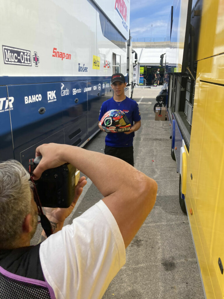 Sean Dylan Kelly was posing for a sponsor shot in between the transporters at the Grand Prix of Portugal and someone said, “Remember, it's less about you and more about the helmet.” A professional racer's job is definitely more than just knowing how to get on the gas early. Photo by Michael Gougis.