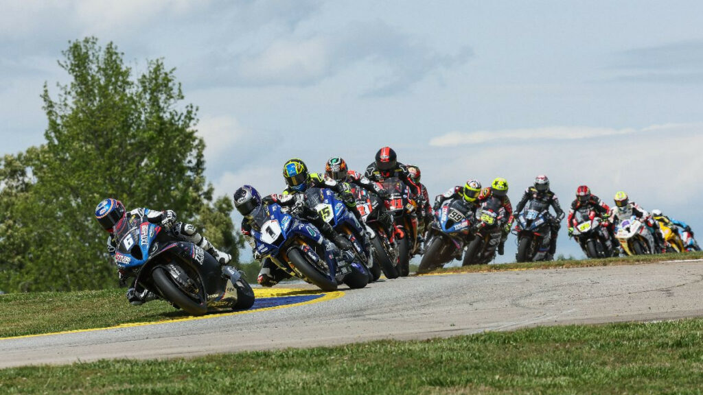 Cameron Beaubier (6) leads Jake Gagne (1), Cameron Petersen (45), Josh Herrin (hidden) and the rest of the MotoAmerica Medallia Superbike pack on the opening lap at Michelin Raceway Road Atlanta on Sunday. Photo by Brian J. Nelson.