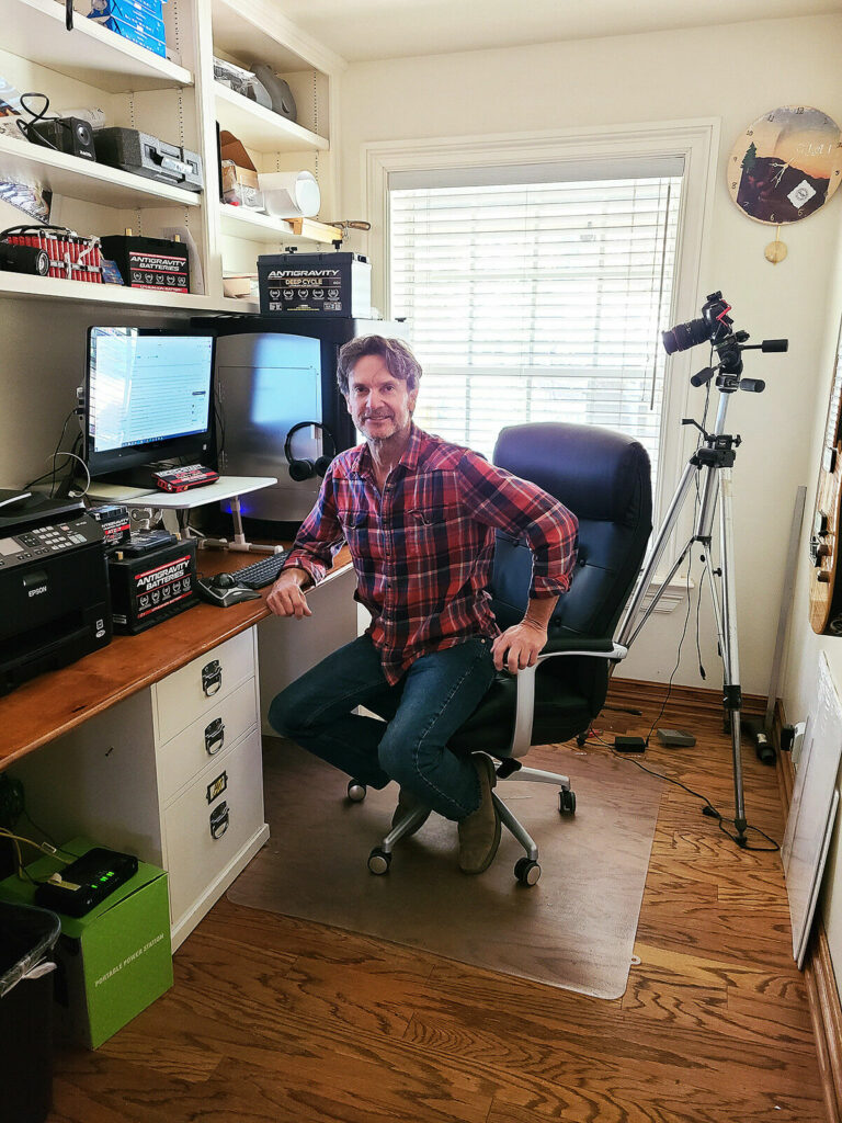 Antigravity Batteries founder/CEO Scott Schafer (seen here in his home office in Ojai, California) was inspired to create his own product after purchasing a short-lived lithium-ion battery for his track bike. Photo courtesy Antigravity Batteries.