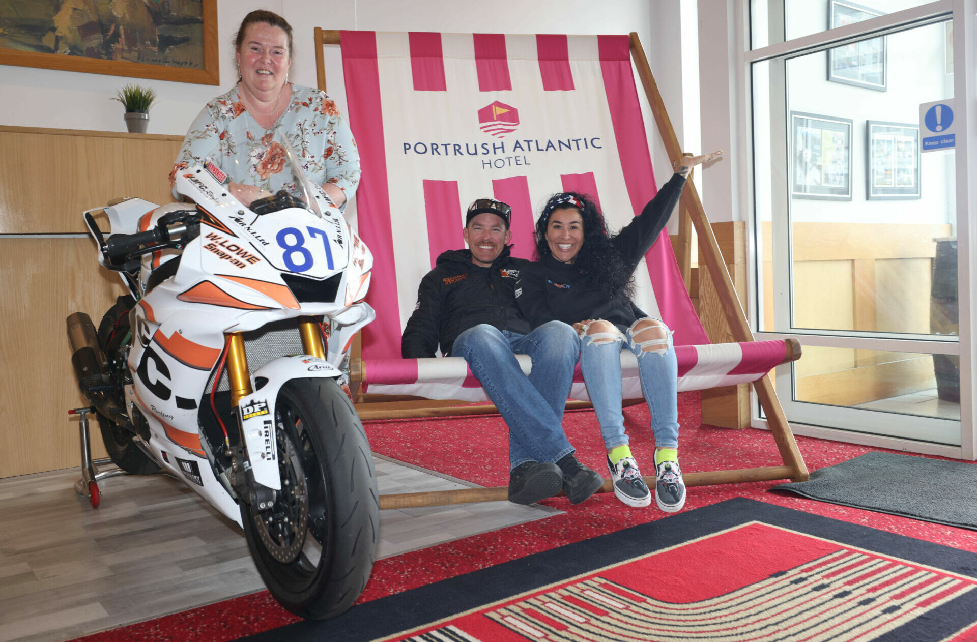Cory West and Patricia Fernandez-West (seated) with Natasha Garrott (standing), the General Manager of the Atlantic Hotel in Portrush. Photo courtesy NW200 Press Office.