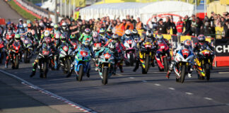 The start of the Superstock race Thursday evening at the North West 200. Alastair Seeley (34), Davey Todd (74), and Michael Dunlop (6) lead the field off the grid. Photo courtesy NW200 Press Office.