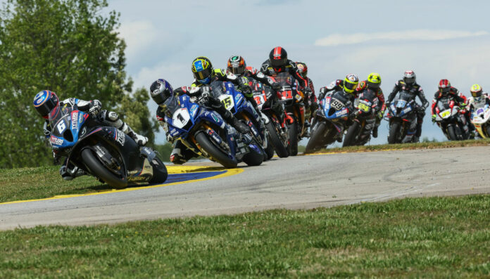 Cameron Beaubier (6) leads Jake Gagne (1), Cameron Petersen (45), Josh Herrin (2), Mathew Scholtz (11), Richie Escalante (behind Scholtz), PJ Jacobsen (66), Toni Elias (24), Corey Alexander (23), David Anthony (25), and Ashton Yates (22) during MotoAmerica Superbike Race Two at Road Atlanta. Photo by Brian J. Nelson.